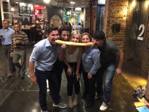 a scavenger hunt team enjoying a snack in Chelesea Market, NYC